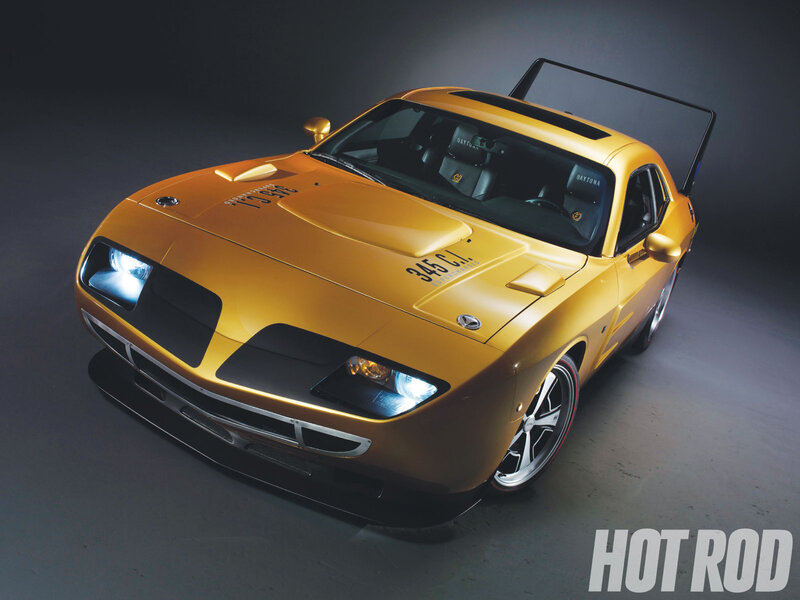 yellow muscle car with hood scoop