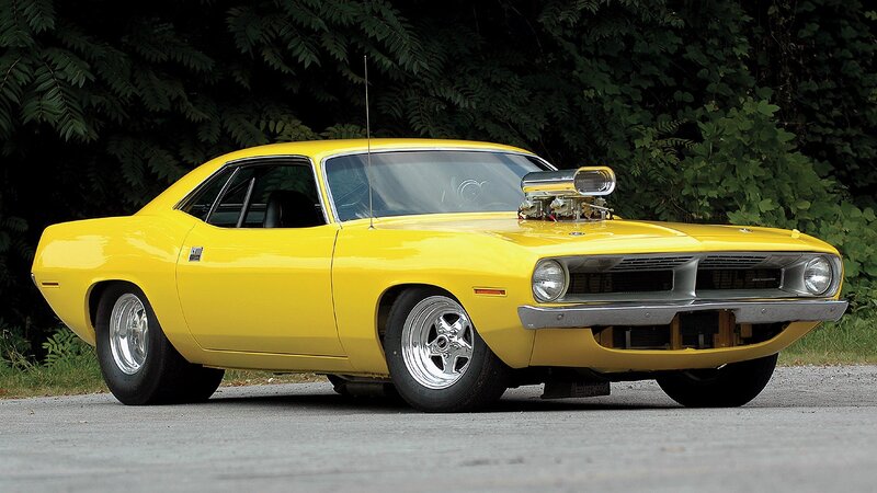 yellow muscle car with supercharger