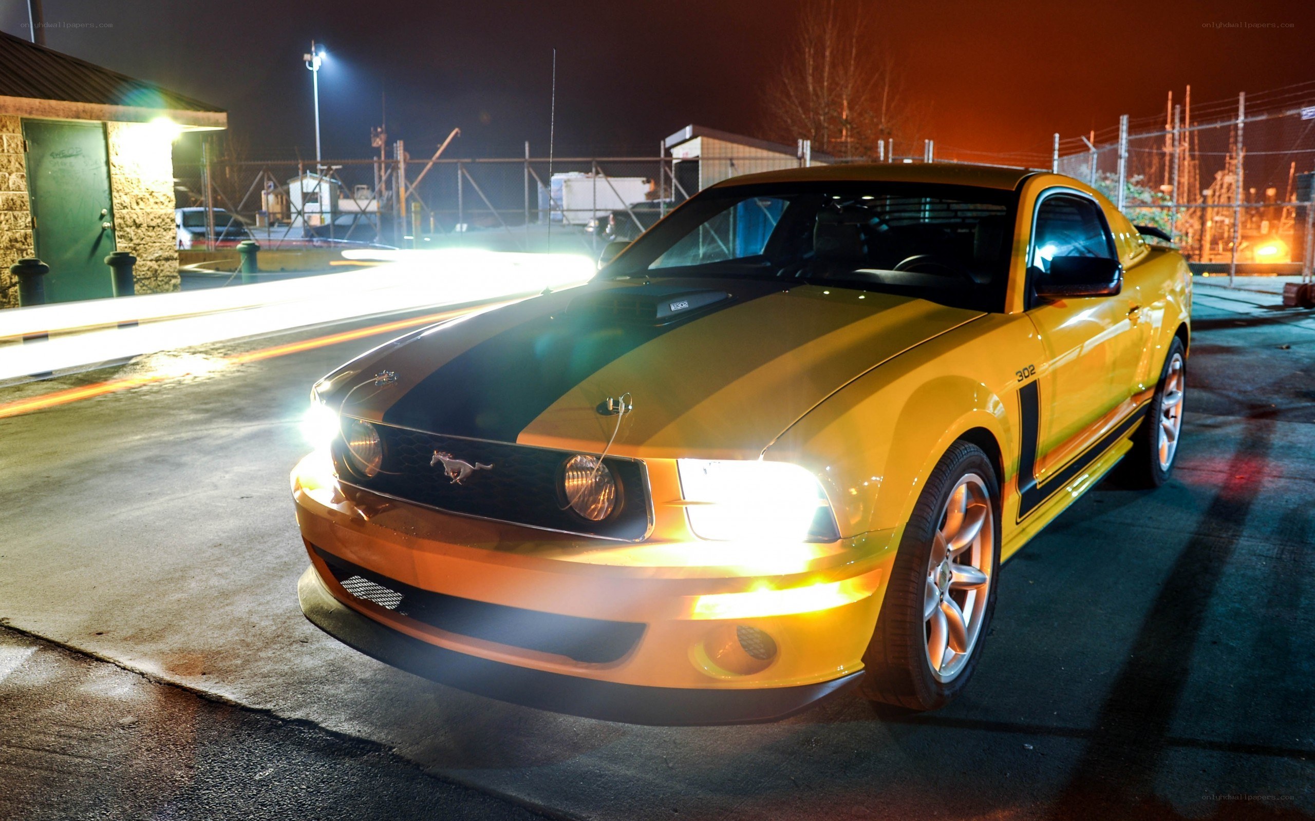 yellow mustang at night