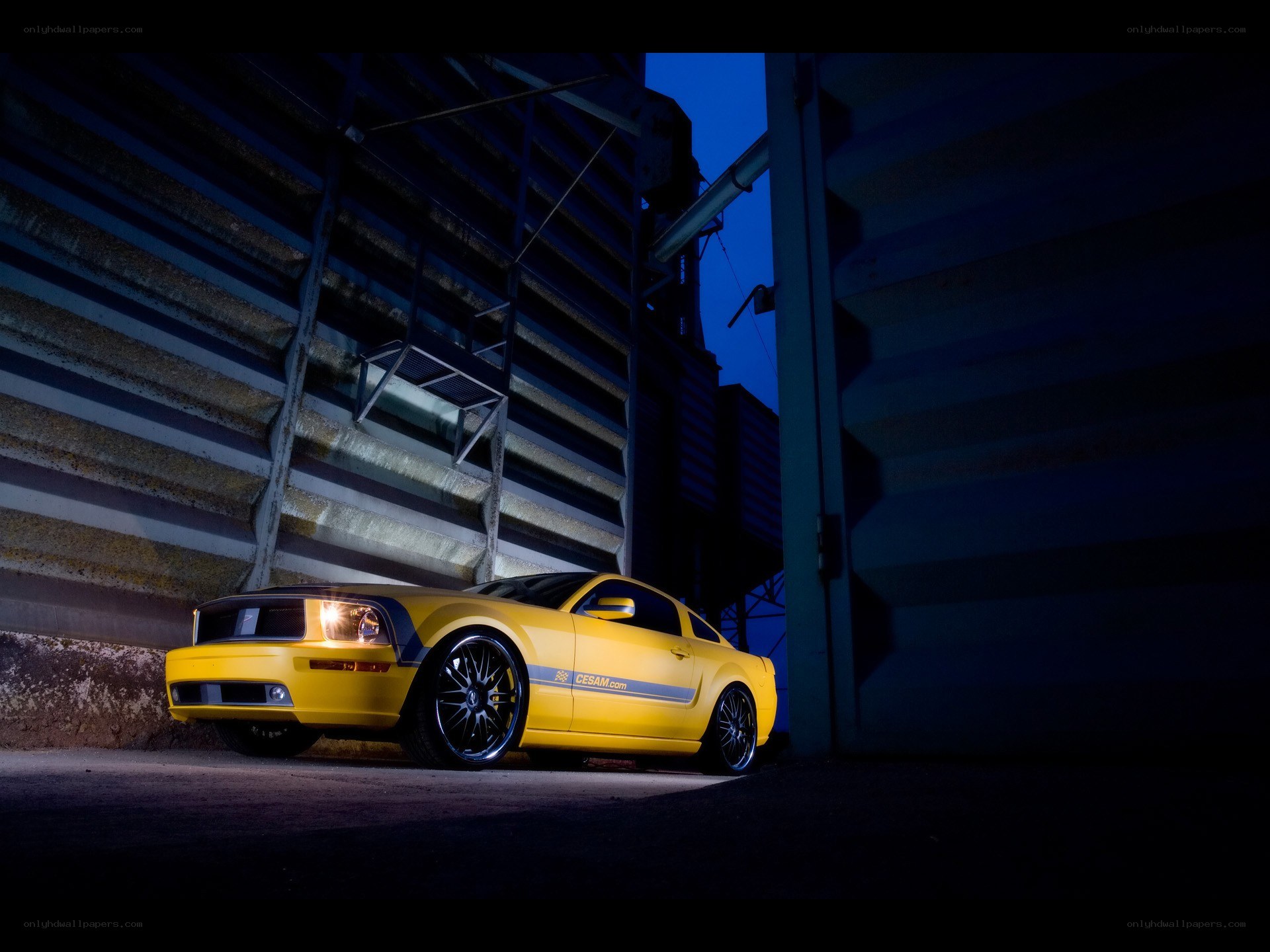 Yellow Mustang at night