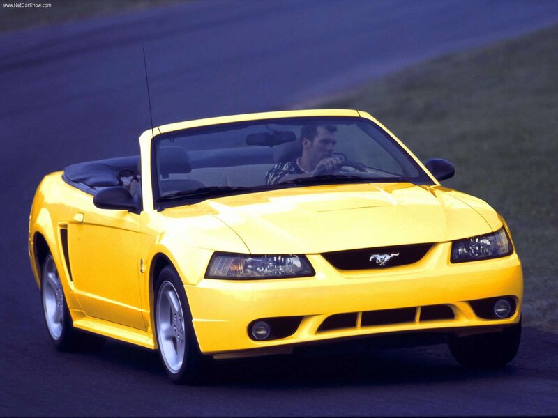 Yellow Mustang convertible on track