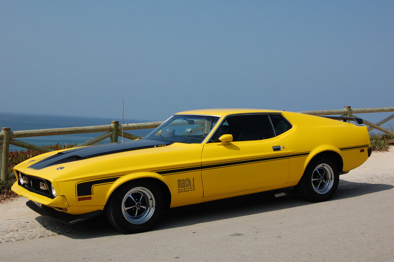 Yellow Mustang Mach 1 by the sea