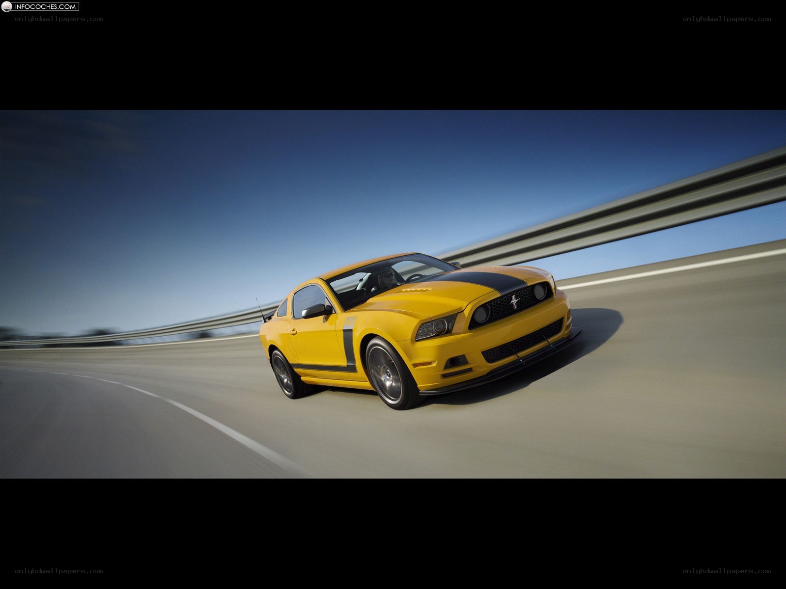 yellow mustang on a road