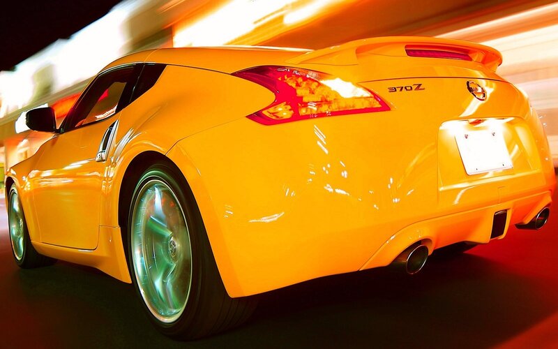 Yellow Nissan 370Z in motion