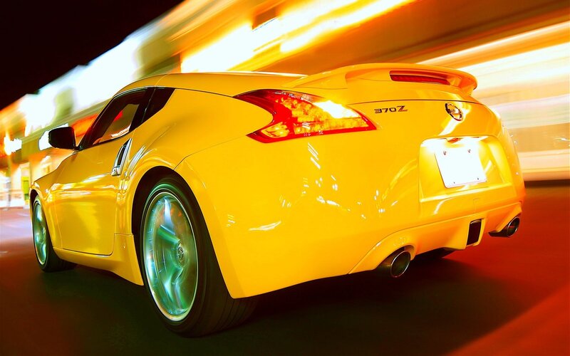 Yellow Nissan 370Z in motion