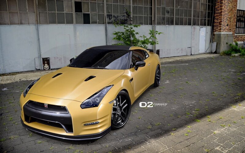 yellow nissan gt-r on brick pavement