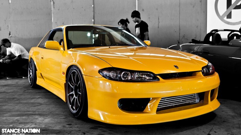 Yellow Nissan S15 at a car show