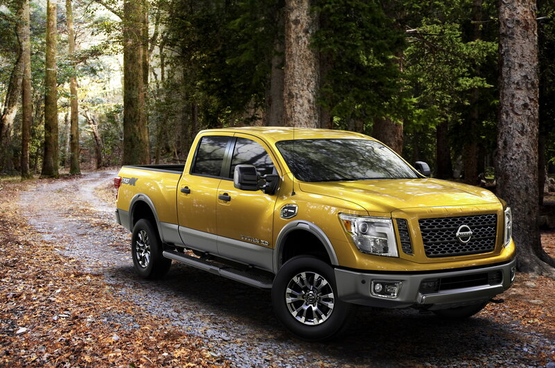 Yellow Nissan Titan XD in forest