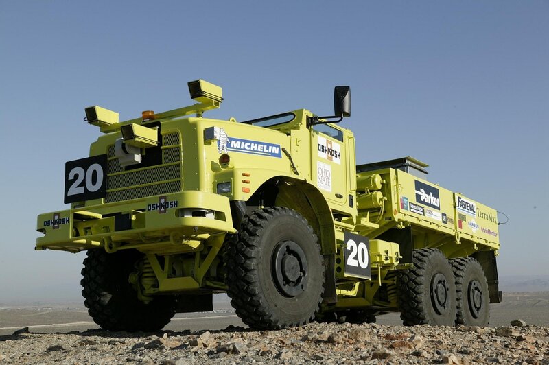 Yellow off-road vehicle on gravel