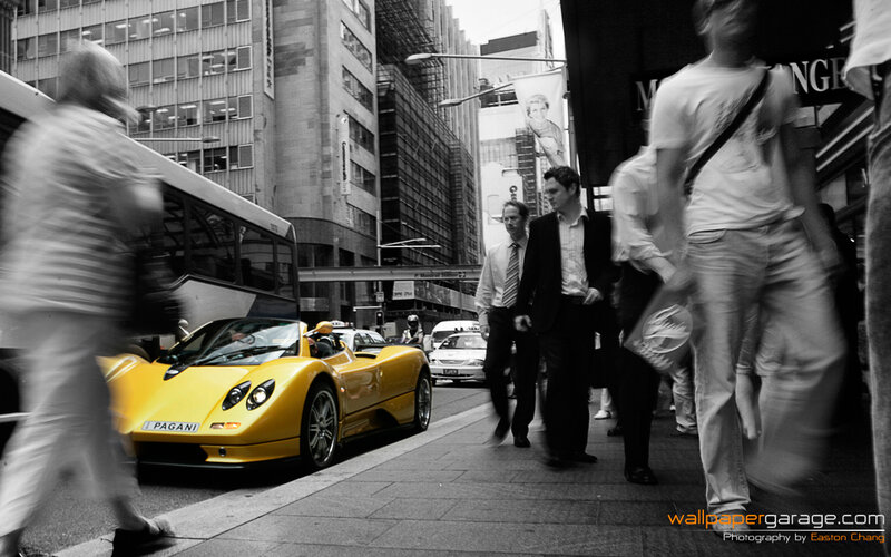 Yellow Pagani on city street