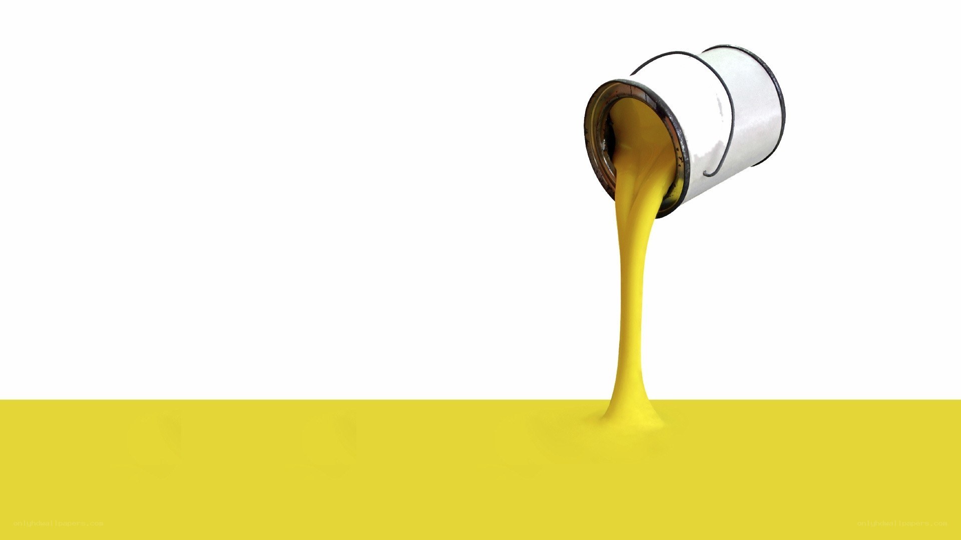 yellow paint pouring from can