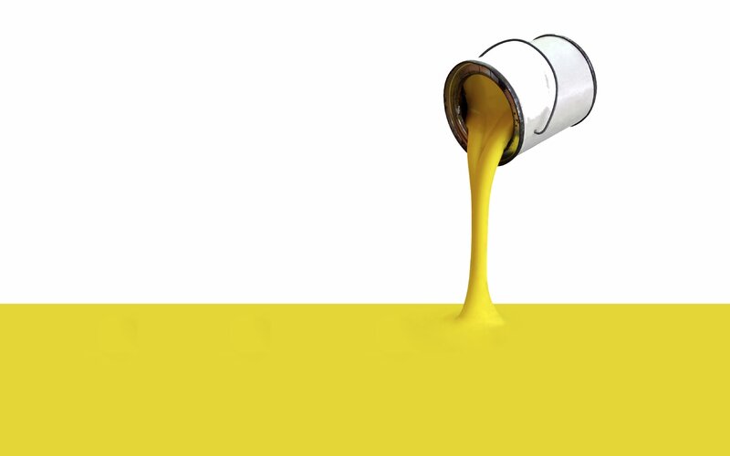 yellow paint pouring from can
