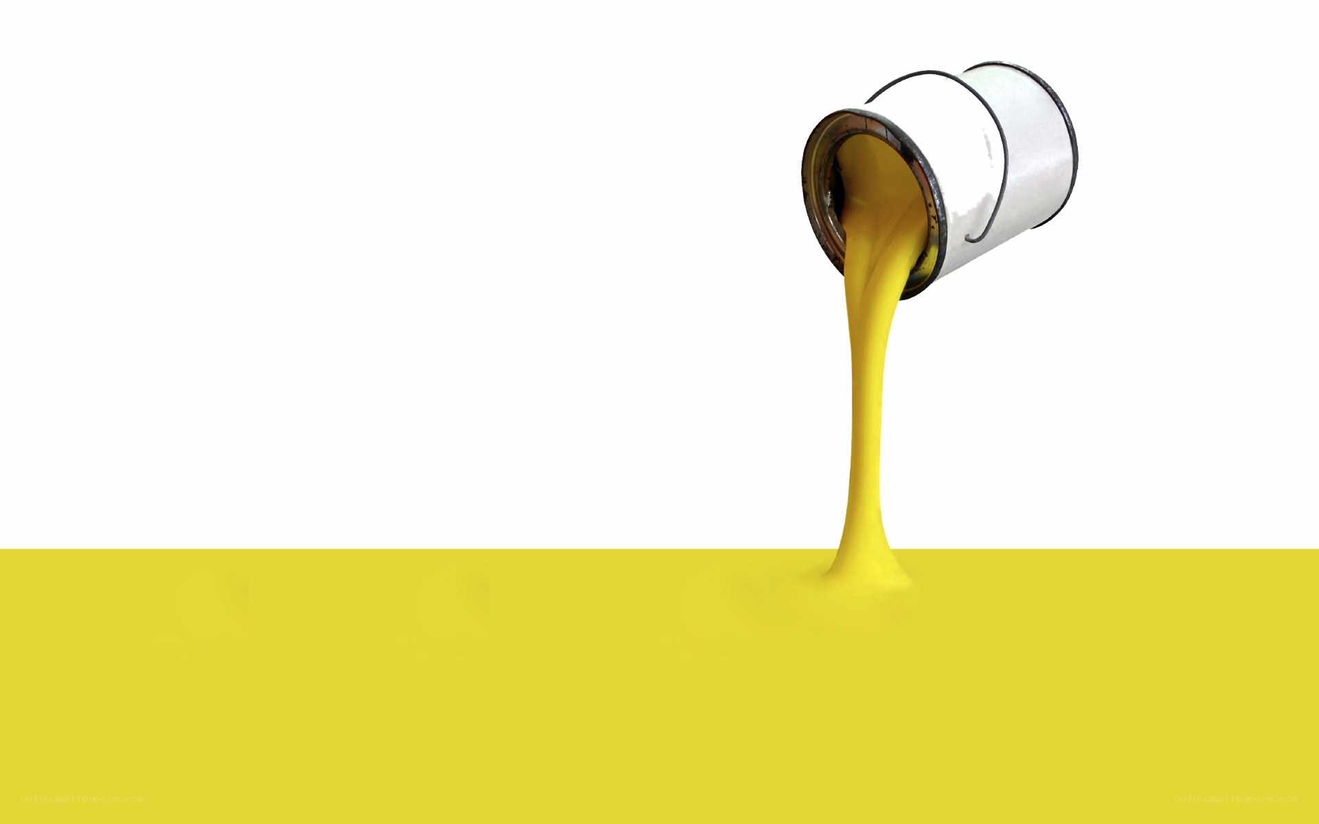 yellow paint pouring from can