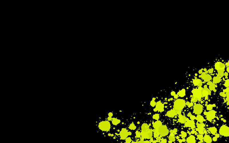 yellow paint splatter on black