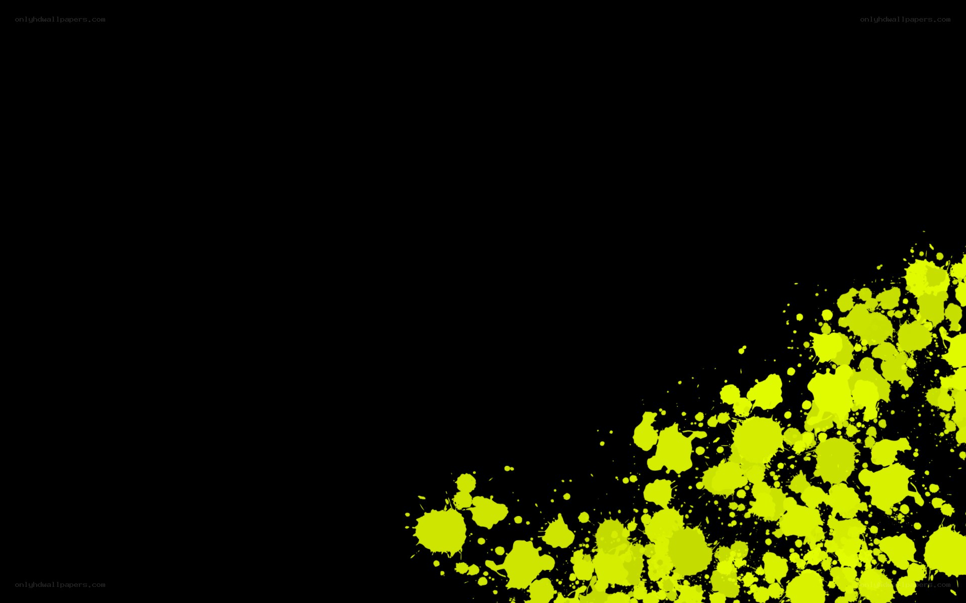 yellow paint splatter on black