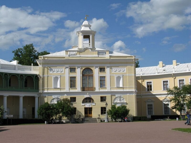yellow palace with bell tower