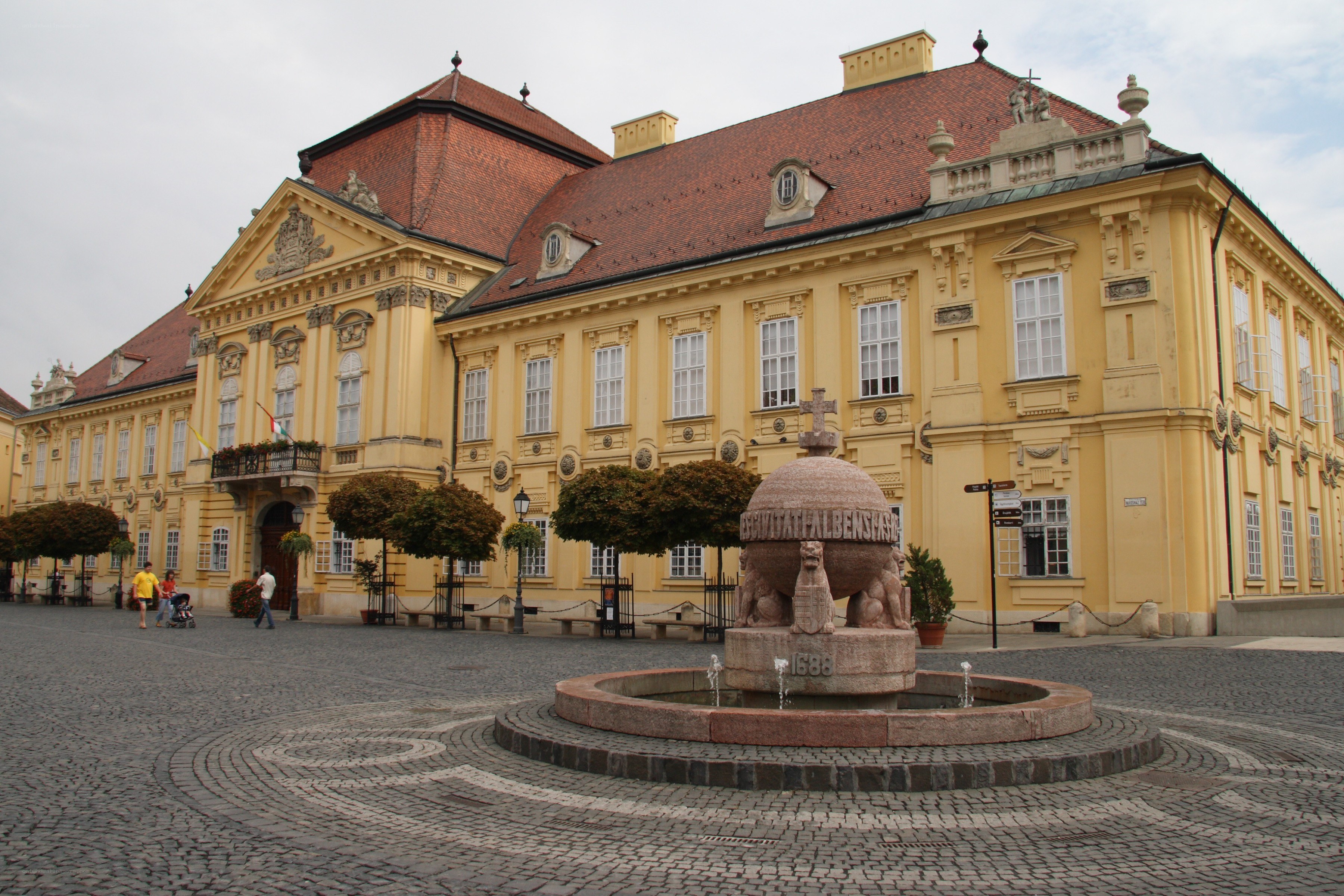yellow palace with fountain