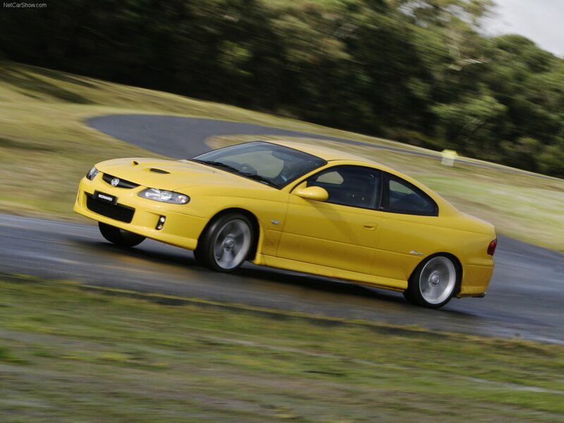 yellow performance coupe in motion