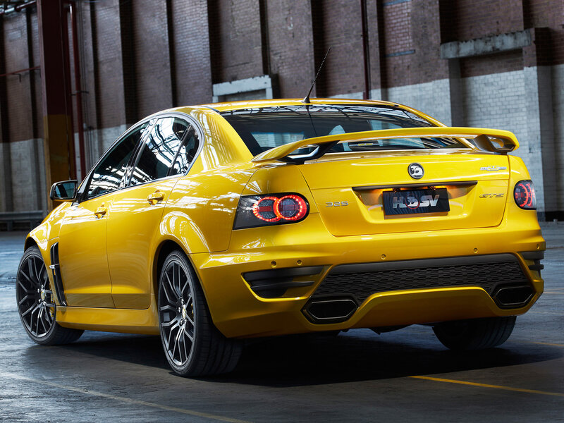 Yellow Performance Sedan — Dramatic, Photograph, Brick Wall, Antenna