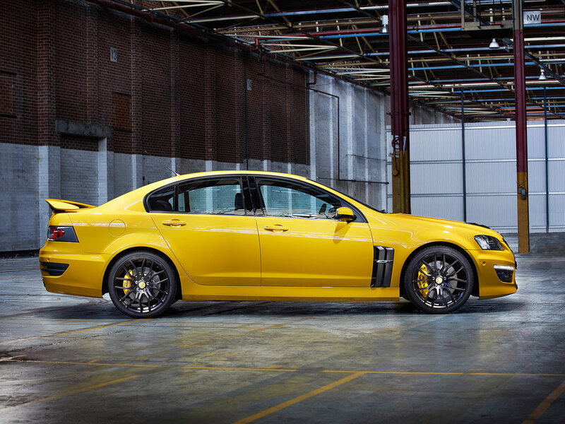 Yellow Performance Sedan — Dramatic, Photograph, Brick Wall