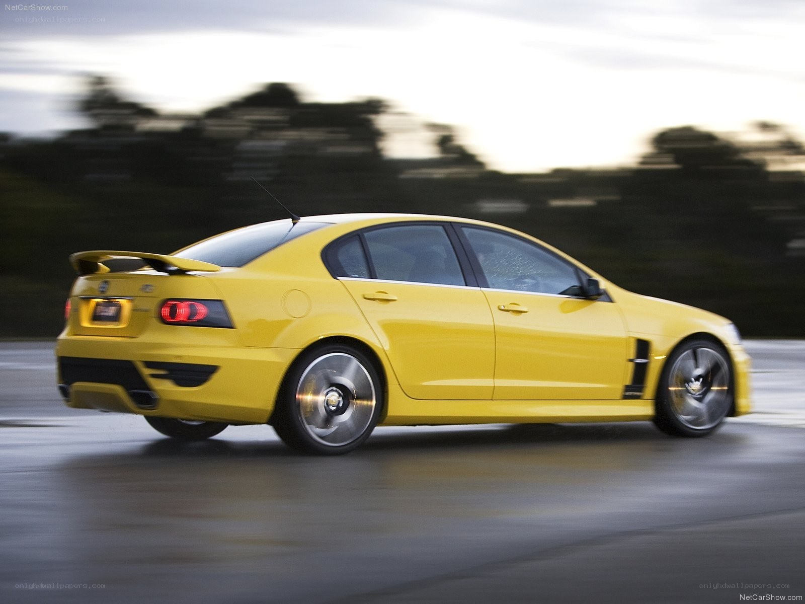 yellow performance sedan in motion