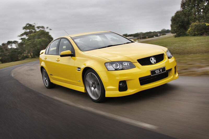 yellow performance sedan in motion
