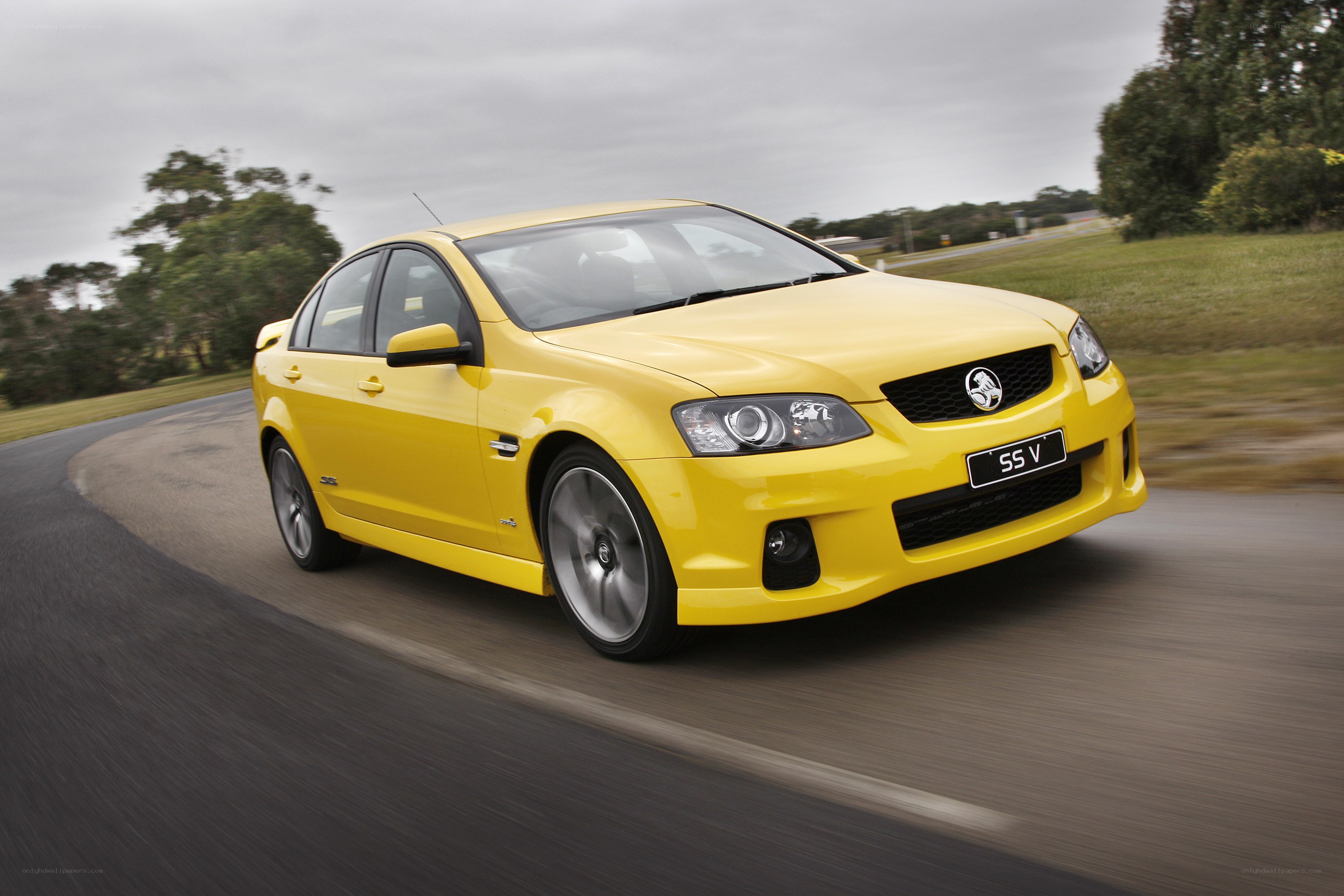 yellow performance sedan in motion