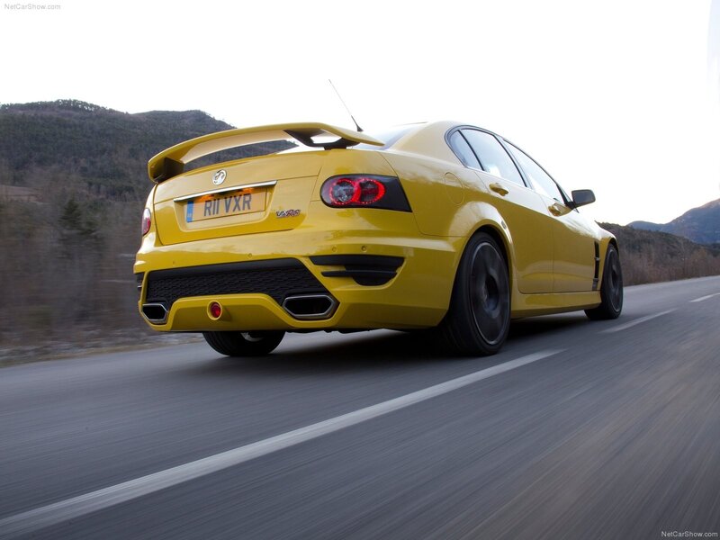 yellow performance sedan on road