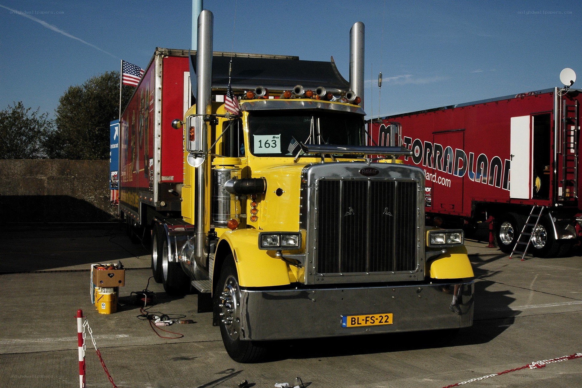 Yellow Peterbilt truck at event