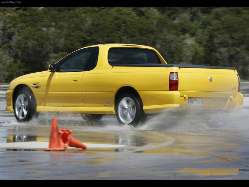 Yellow pickup truck in water