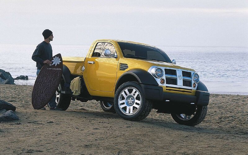 Yellow Pickup Truck on Beach