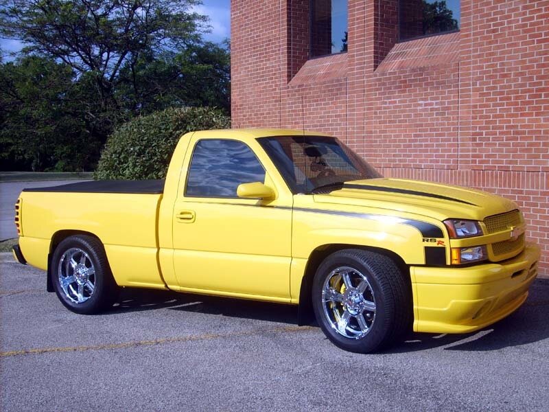 yellow pickup truck parked
