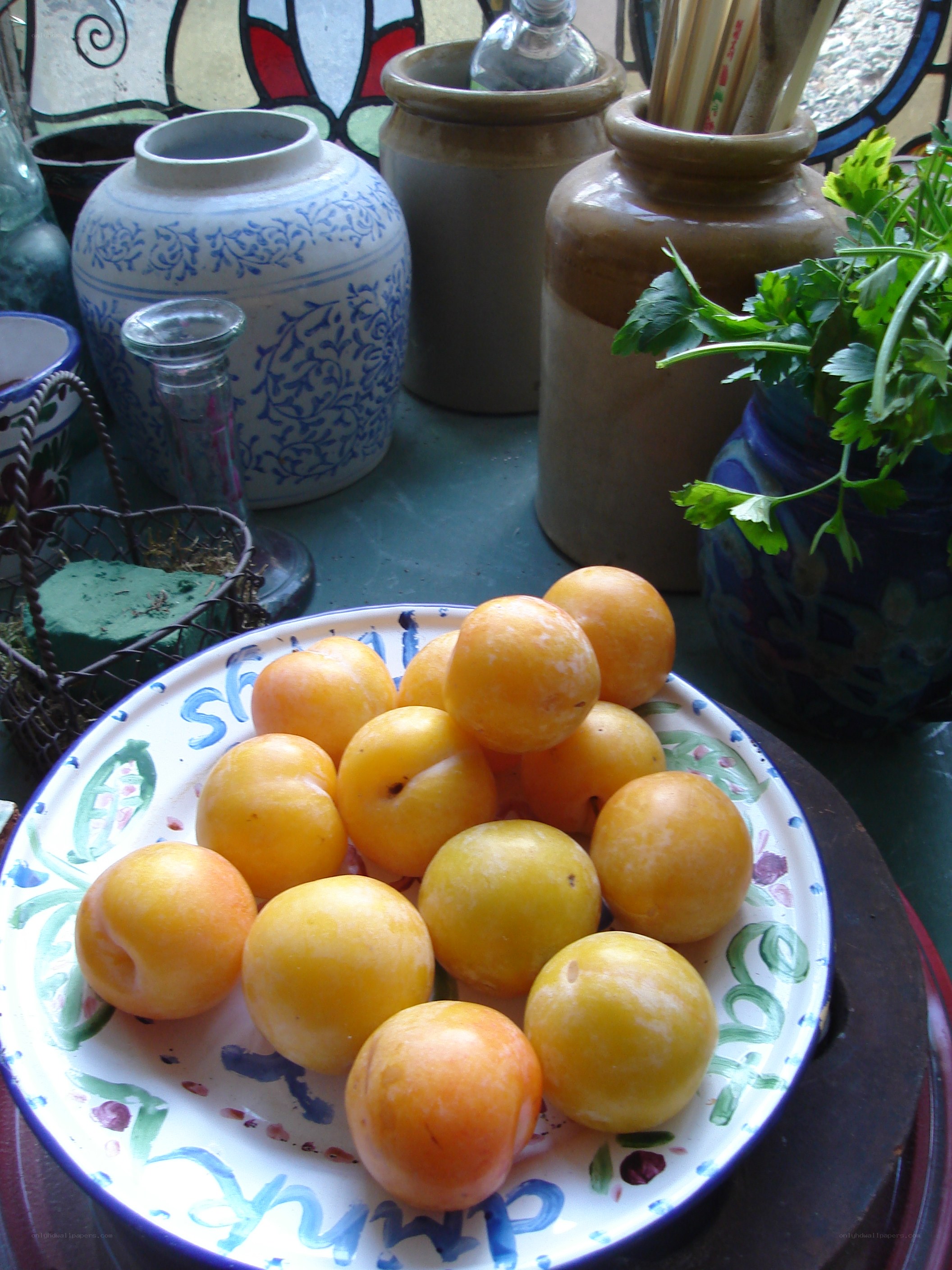 Yellow plums on a decorative plate