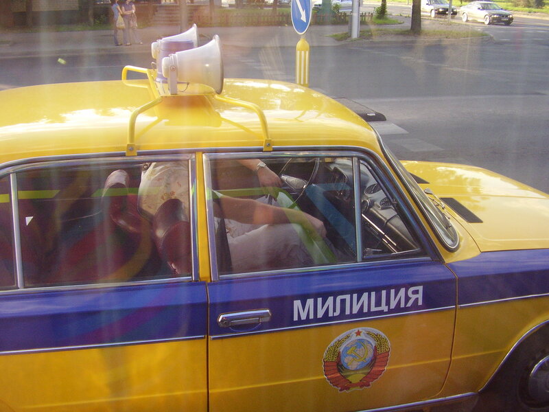 Yellow police car with megaphones