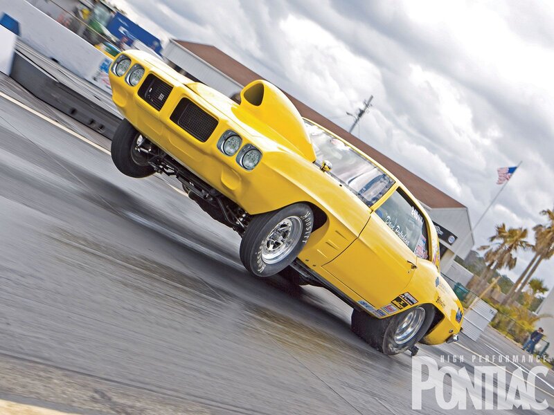 Yellow Pontiac drag racing