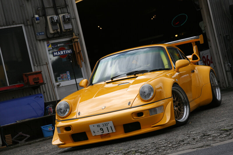 Yellow Porsche 911 in garage