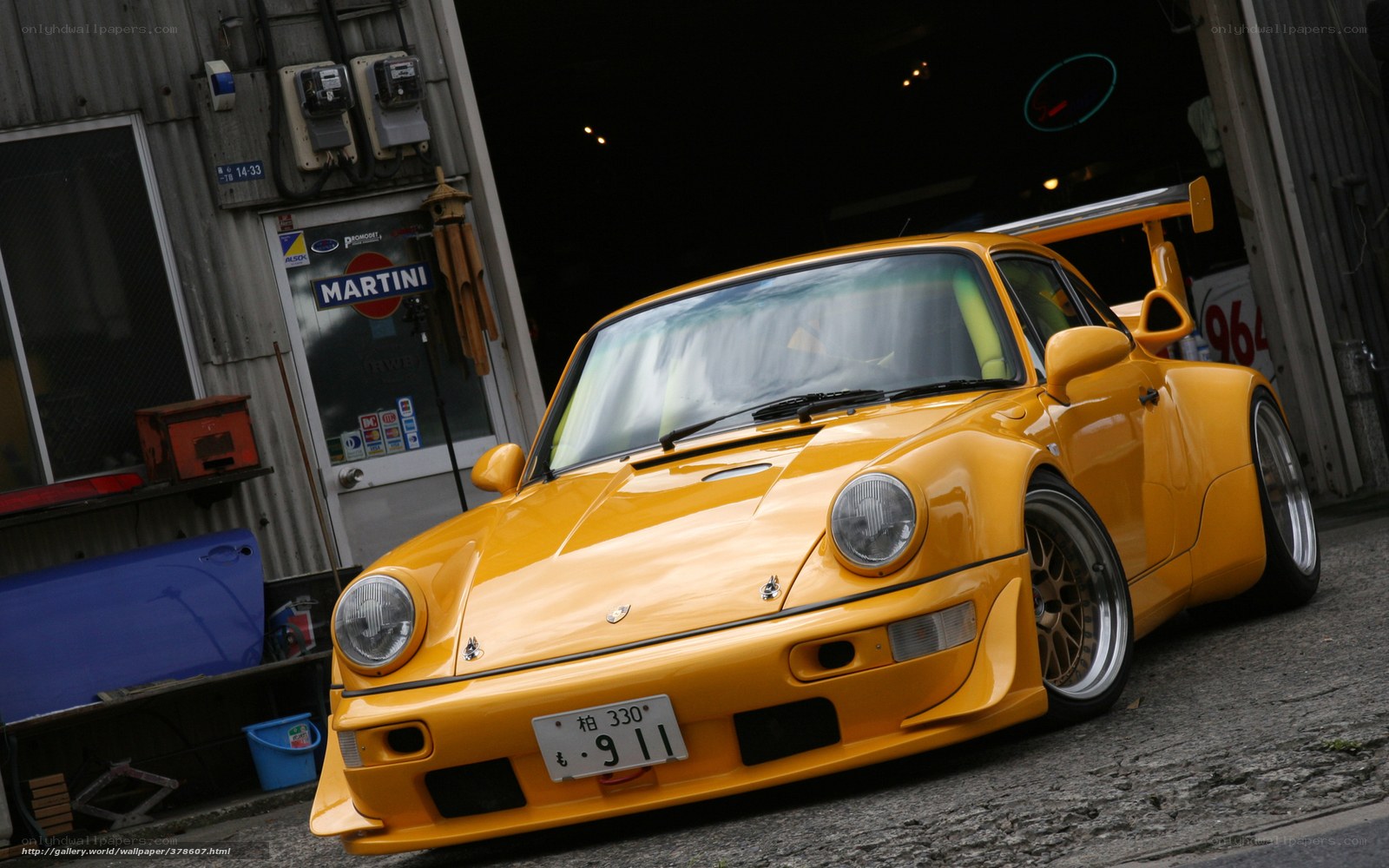 Yellow Porsche 911 in garage