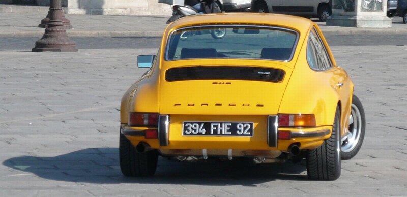 yellow porsche 911 rear view