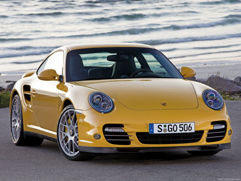 Yellow Porsche 911 Turbo on beach