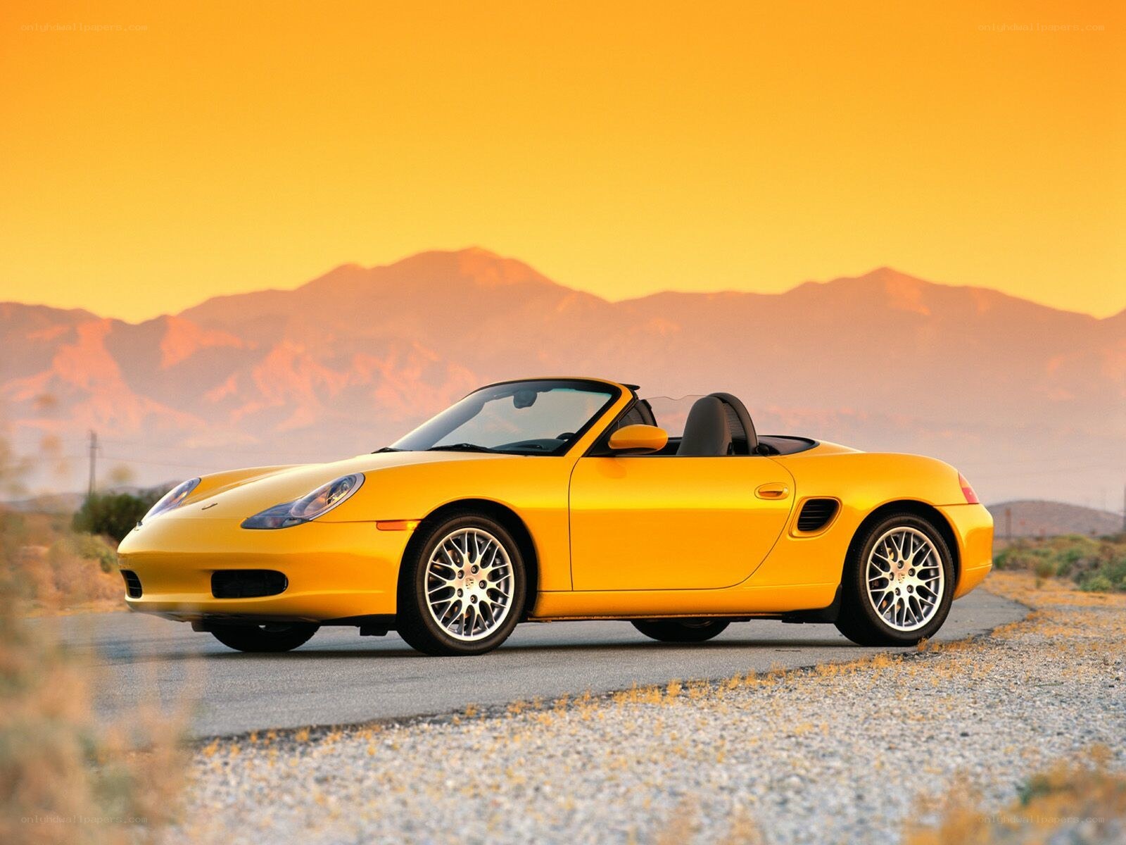 Yellow Porsche Boxster at sunset