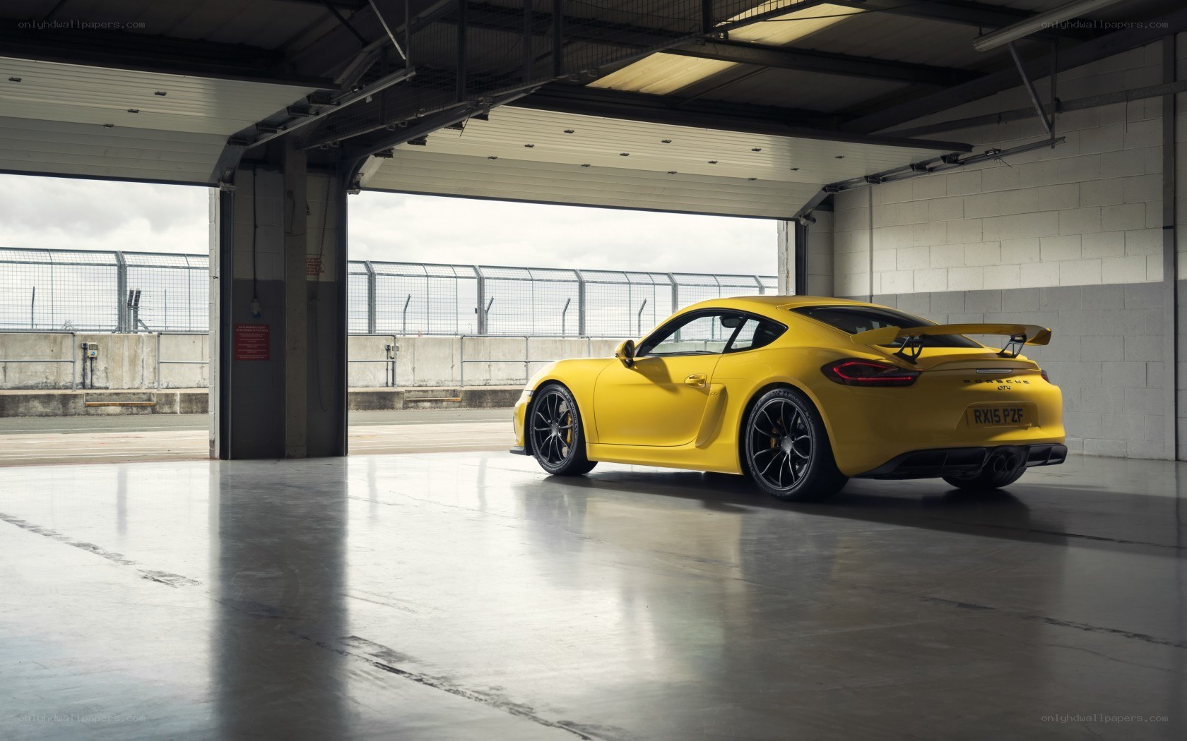 Yellow Porsche Cayman GT4