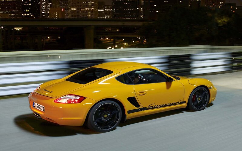 Yellow Porsche Cayman S at night
