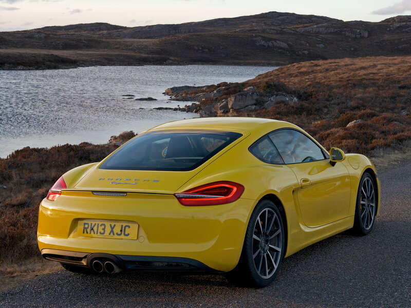 Yellow Porsche Cayman S by a lake