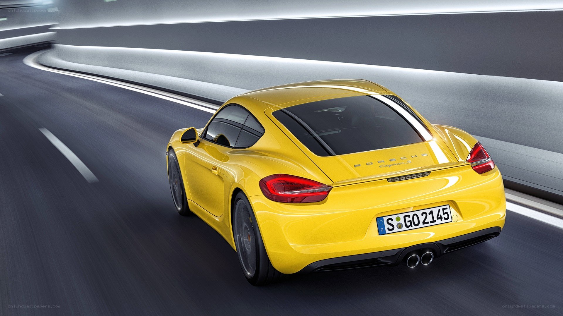 yellow porsche cayman s driving