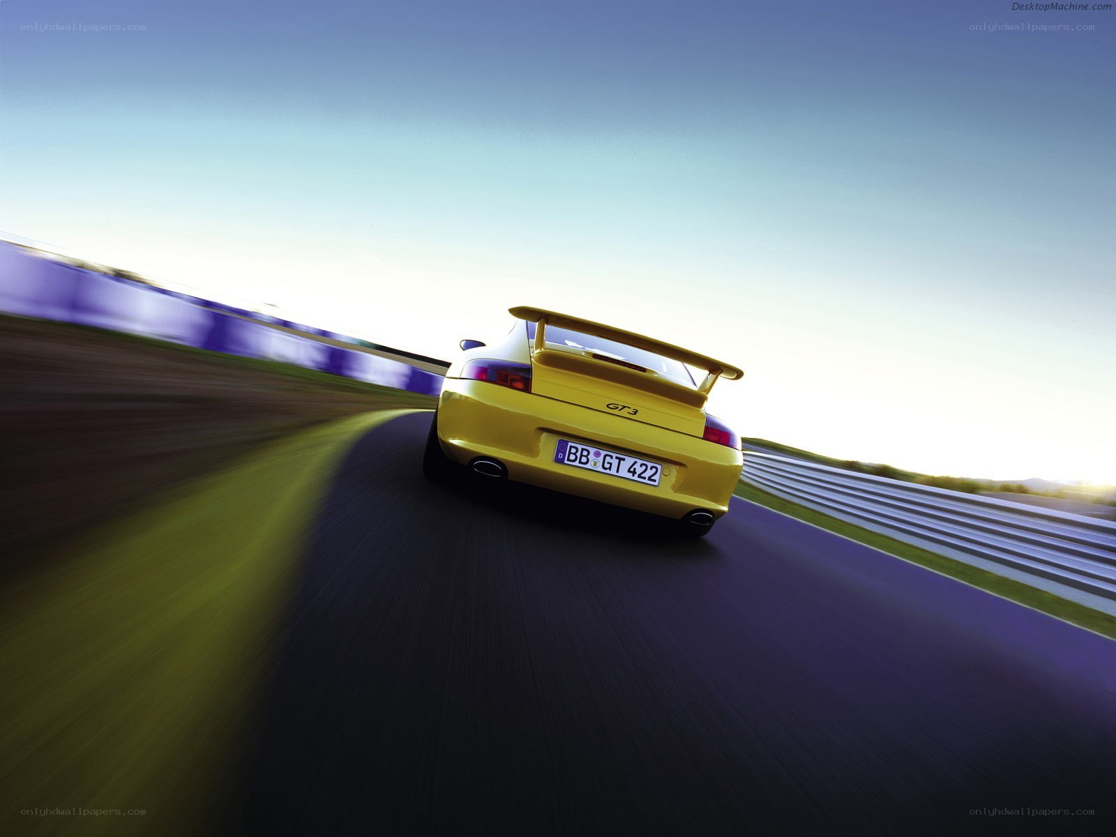 Yellow Porsche GT3 on racetrack