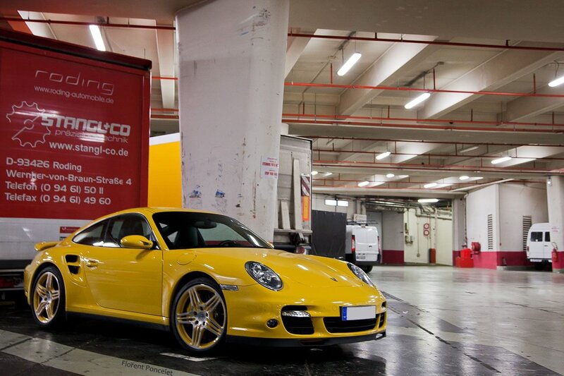 Yellow Porsche in parking garage