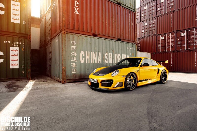 Yellow Porsche in shipping yard