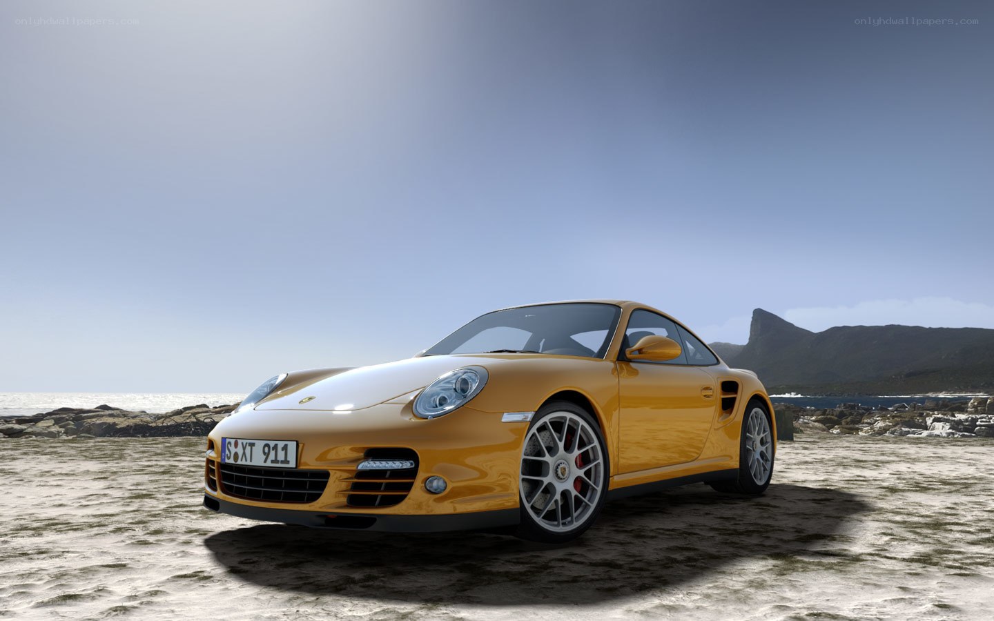 Yellow Porsche on a beach