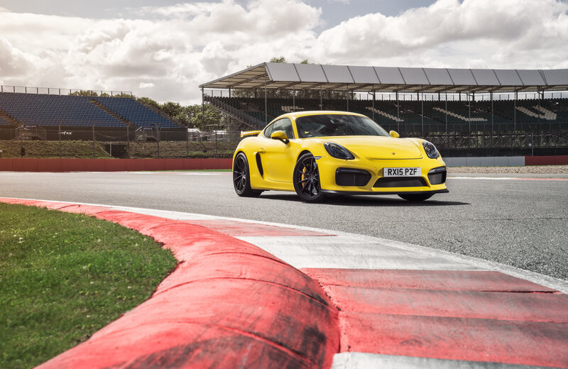 Yellow Porsche on a racetrack