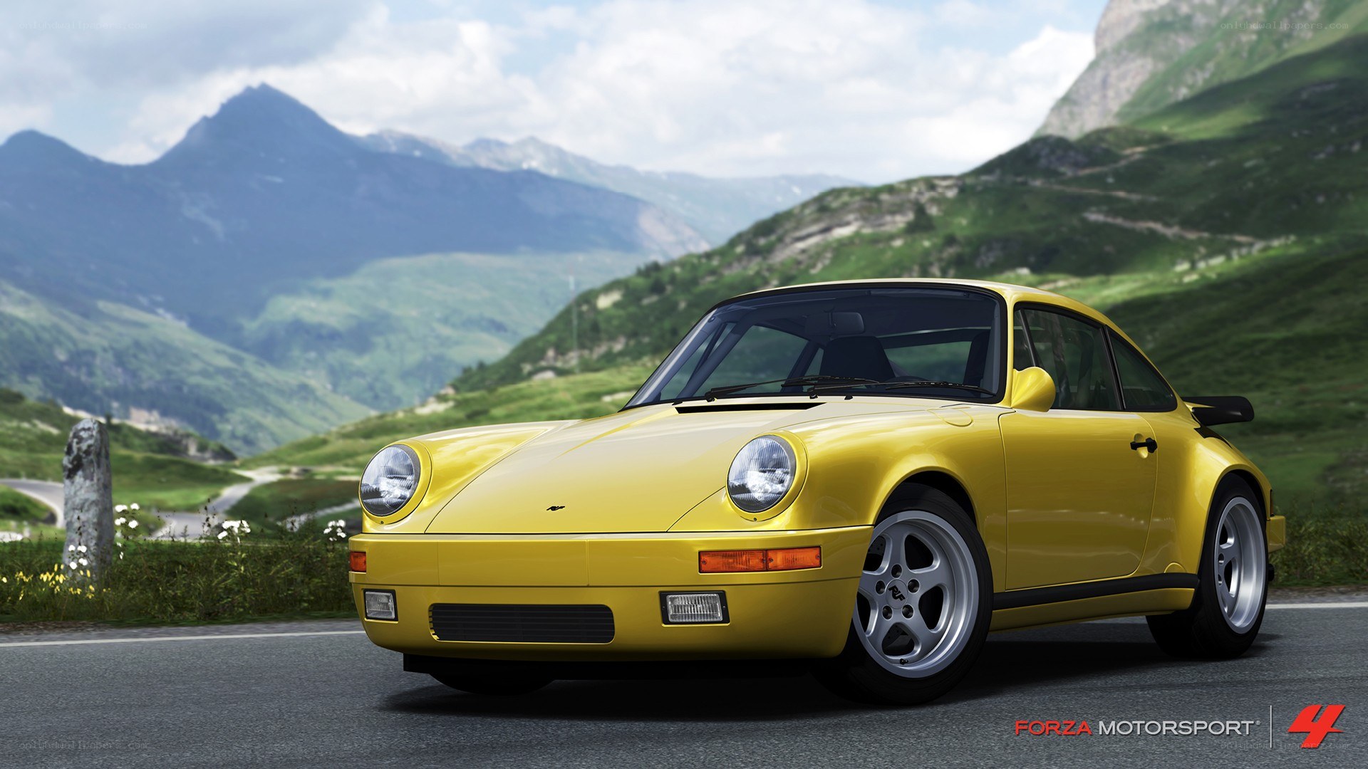 yellow porsche on mountain road